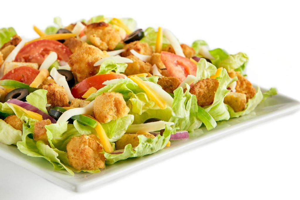 Crispy Chicken Salad · Iceberg lettuce, red onion, mozzarella cheese, cheddar cheese, chicken strip pieces, Roma tomatoes, seasoned croutons, and choice of dressing.