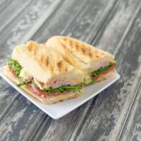 Ham and Brie · Heritage ham, imported Brie, arugula, tomato, mayo and our home made maple mustard.