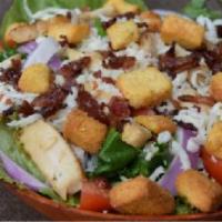 Pesto Ranch Club Salad · Spring mix topped with red onion, fresh tomatoes, chicken, mozzarella, bacon, and croutons. ...