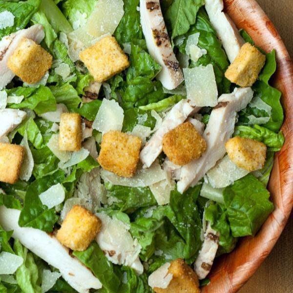 Chicken Caesar Salad · Chopped romaine lettuce, grilled chicken, crunchy croutons, shaved Parmesan cheese and your choice of dressing.