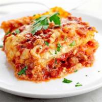 Family Size Lasagna Baked with Cheese · Served with large green salad and 2 order of garlic bread.
