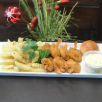 Shrimp Dinner · 7 pieces of shrimp. Served with French fries, coleslaw and dinner roll.