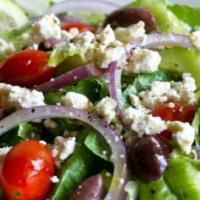 Greek Salad · Romaine lettuce, spinach, cucumber, feta, green and black olives, tomatoes and Greek dressin...