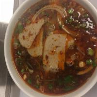 17. Bun Bo Hue · Large. Spicy noodle soup served with well cooked beef and pork sausage and large vermicelli ...