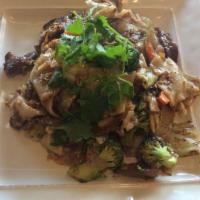 32. Pad See-Ew · Stir-fry wide rice noodles with your choice of meat, egg, broccoli, cabbage, and carrot in s...