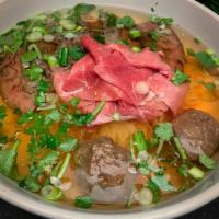 Pho Present Soup · The most popular soup in vietnam. Sliced beef, meatball, with rice noodle in a delicate beef...