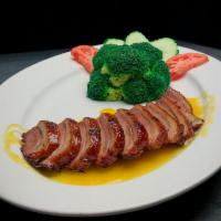 Country Road · Roasted duck until crispy then topped with chefs special orange sauce.