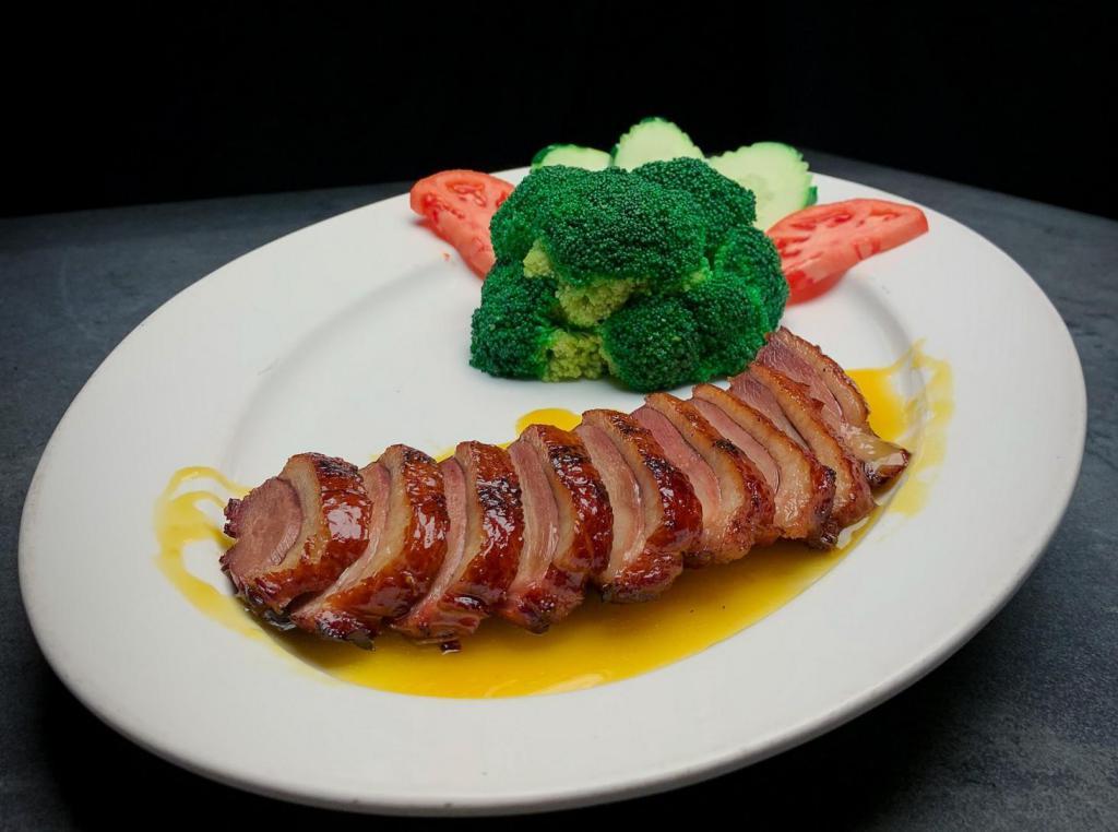 Country Road · Roasted duck until crispy then topped with chefs special orange sauce.