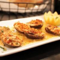 Baked Clams · 6 pieces. Baked clams topped with bread crumbs and oregano.