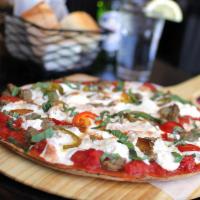 Fra Diavolo Pizzetta · Crumbled sausage, hot cherry peppers, spots of ricotta.