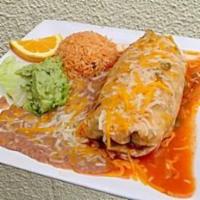 Grande Burrito · Grilled meat with rice and beans rolled in a large flour tortilla. Topped with ranchera sauc...