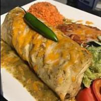 Chile Verde Burrito · Pork chile verde, rice and beans rolled in a large flour tortilla topped with green sauce an...