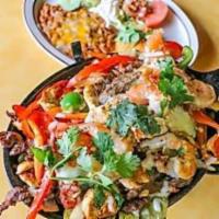 Cabrera's Famous Fajitas · Steak, Chicken or shrimp mixed with bell peppers, onion, tomato, grilled cactus and cheese; ...
