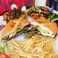 Torta Moreliana · Mexican-style sub filled with beef sirloin steak, chicken breast, ranchero cheese, and avoca...