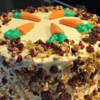 Carrot Cake · Organic Carrot Cake! Back by popular demand! Topped with walnuts and dried cranberries!