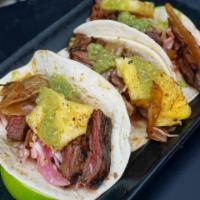Grilled Steak Tacos · Salsa, verde, avocado and pineapple red cabbage slaw.