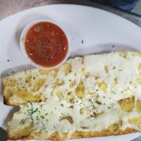 Cheese Garlic Bread · Pizza bread topped with our NY house garlic butter and mozzarella cheese.