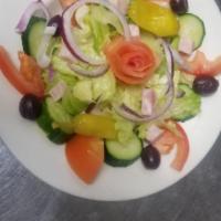 Side Salad · Healthy mix of lettuce, onion, cucumbers, tomatoes, black olives and pepperoncini.