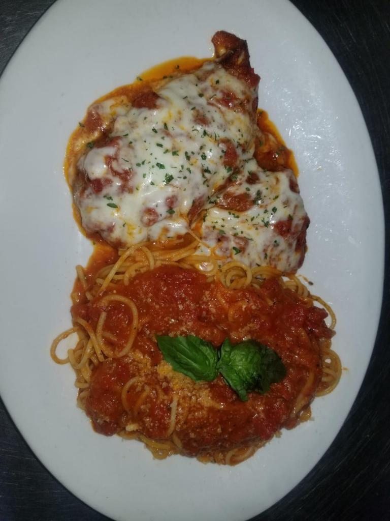 Eggplant Parmigiana · Baked eggplant patty served with our NY marinara sauce, mozzarella cheese served with a side of spaghetti.