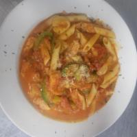 Chicken Cacciatore with salad and garlic roll · Slice chicken breast with mushrooms bell peppers onions Served with marinara sauce and penne...