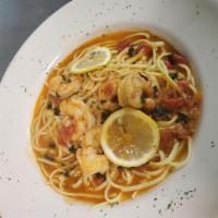 Shrimp Scampi · Shrimp sauteed in garlic and butter in a white wine sauce. Served with linguini pasta.