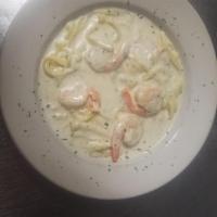 Shrimp Alfredo Pasta · Shrimp sauteed in garlic with creamy Alfredo sauce. Served with fettuccine pasta.