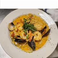 Seafood Combo 1 · Clams, mussels, shrimp, and calamari with marinara pink sauce. Served with linguine.