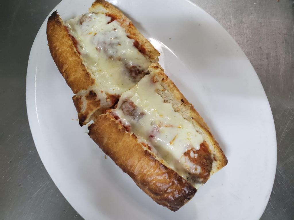 Sausage and Pepper Parmigiana Sub · French bread, green bell peppers, Italian sausage, mozzarella cheese, Parmigiana cheese and our NY marinara sauce.