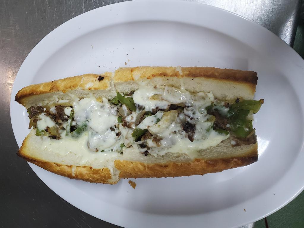 Philly Cheesesteak Sub · French bread, steak with mushrooms, green bell peppers, onions and mozzarella cheese.