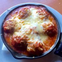 Meatballs · Baked meatballs (about 8) with marinara sauce topped with melted mozzarella.