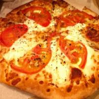 White Pizza · Mozzarella cheese, ricotta, oregano, tomatoes and fresh garlic.