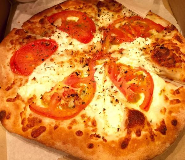 White Pizza · Mozzarella cheese, ricotta, oregano, tomatoes and fresh garlic.