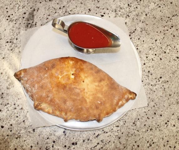 Traditional Calzone · Served with 1 sauce. Add toppings for an additional charge.