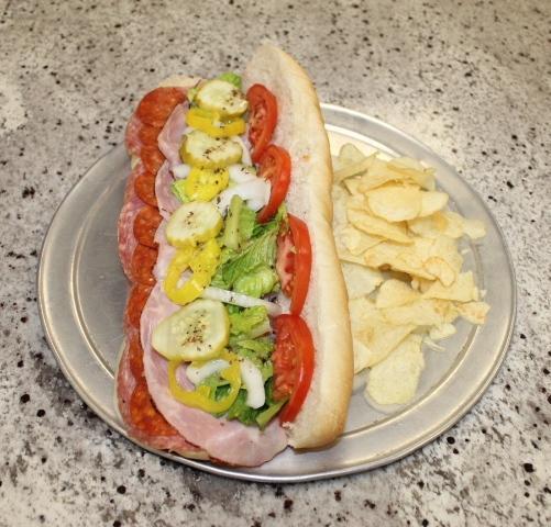 Italian Combo Sub · Ham, salami, pepperoni and provolone with lettuce, tomato, onions, banana peppers, pickles and sub dressing.
