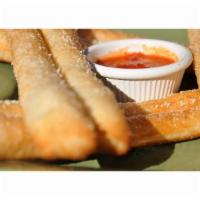 Bread Sticks · Brushed with garlic sauce, topped with Parmesan cheese and served with marinara sauce.