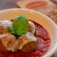 Meatball Parmesan · Meatballs in marinara topped with mozzarella and Parmesan.
