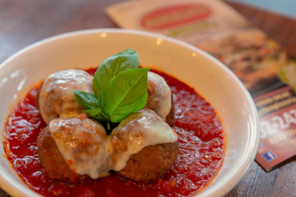 Meatball Parmesan · Meatballs in marinara, topped with mozzarella and Parmesan cheese.