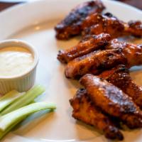Wings · Choice of sauce: Buffalo, BBQ, garlic or plain. Served with ranch or blue cheese dressing.