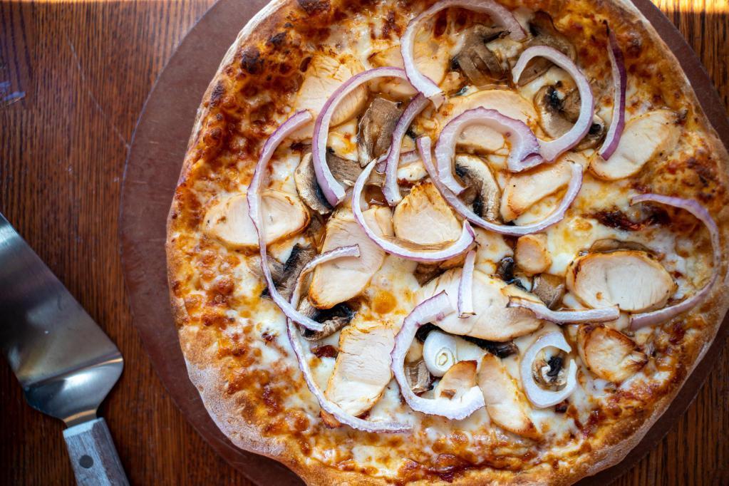 Spicy Chicken Pizza · Spicy red pepper sauce, red onions, mozzarella cheese, mushrooms, grilled chicken and sun dried tomatoes.