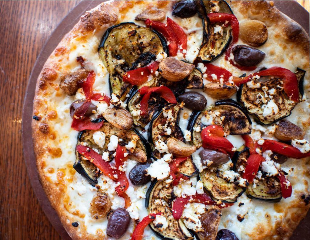 Roasted Eggplant Pizza · Garlic herb sauce, eggplant, sun-dried tomatoes, roasted red peppers, roasted garlic, feta cheese and Kalamata olives.