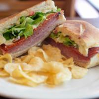 Italian Feast Sandwich · Genoa salami, ham, pepperoni, mozzarella, lettuce, caramelized onions, tomatoes, mayo, and m...