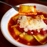 Spinach Ravioli · Filled with spinach and ricotta cheese topped with marinara and mozzarella cheese.