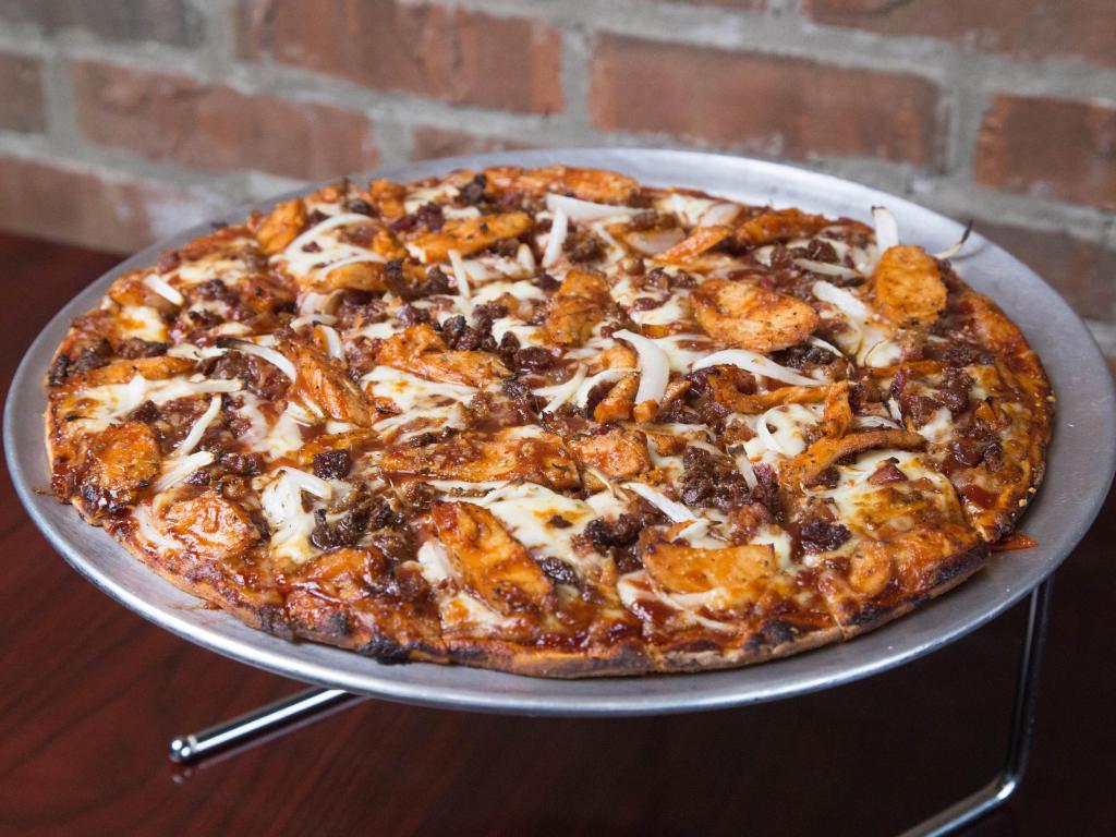 BBQ Chicken Pizza · Our unique barbecue blended pizza sauce, marinated chicken, onions and bacon.