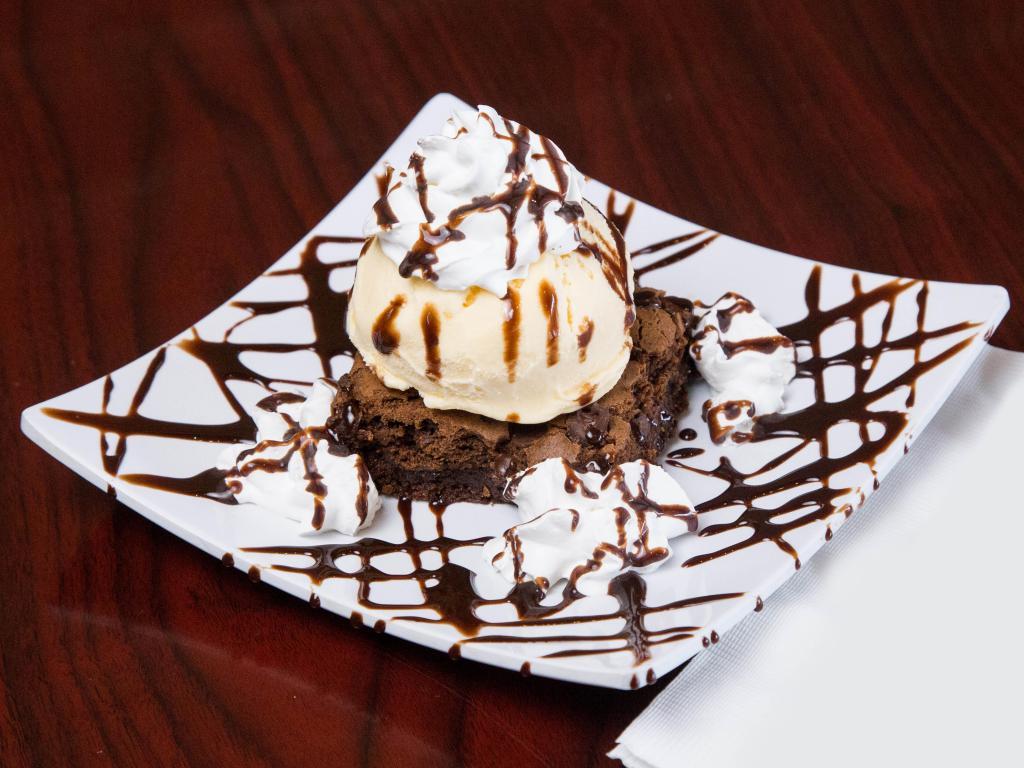 Delicious Chocolate Brownies · Served with chocolate chips.
