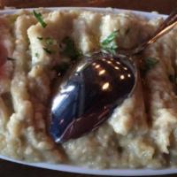 Baba Ghanoush · Char-grilled smoked eggplant puree flavored with tahini, garlic, olive oil and lemon juice.