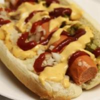 Vegan Hot Dawg · Vegan hot dawg in a bun with relish and onion, ketchup and mustard.