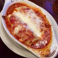 Pasta Trio · A sample of delicious lasagna, baked manicotti and cannelloni all in 1 dish.