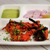 Lamb Chops · Tender lamb chops marinated in Indian spices and char-grilled on skewers tandoori style in a...