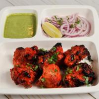 Chicken Tikka Kebab · Chicken breast marinated with spices and yogurt and grilled in our clay oven and cooked on s...