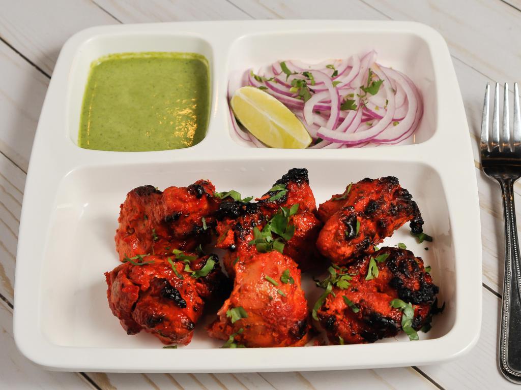 Chicken Tikka Kebab · Chicken breast marinated with spices and yogurt and grilled in our clay oven and cooked on skewers tandoori style in a clay oven.